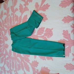 Green Calvin Klein pants with zipper accents